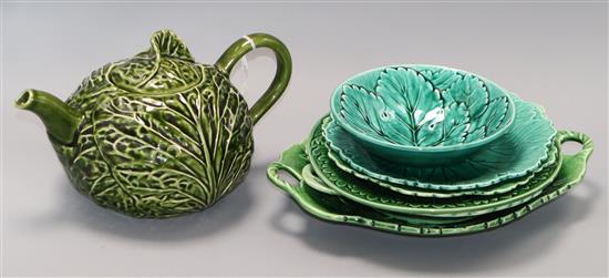 A green leaf teapot and a collection of similar plates, dishes and a bowl